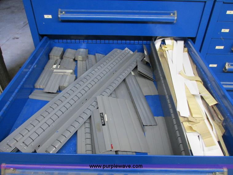 image for item V9965 Equipto parts bin and assorted Caterpillar parts