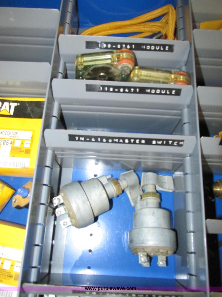image for item V9965 Equipto parts bin and assorted Caterpillar parts