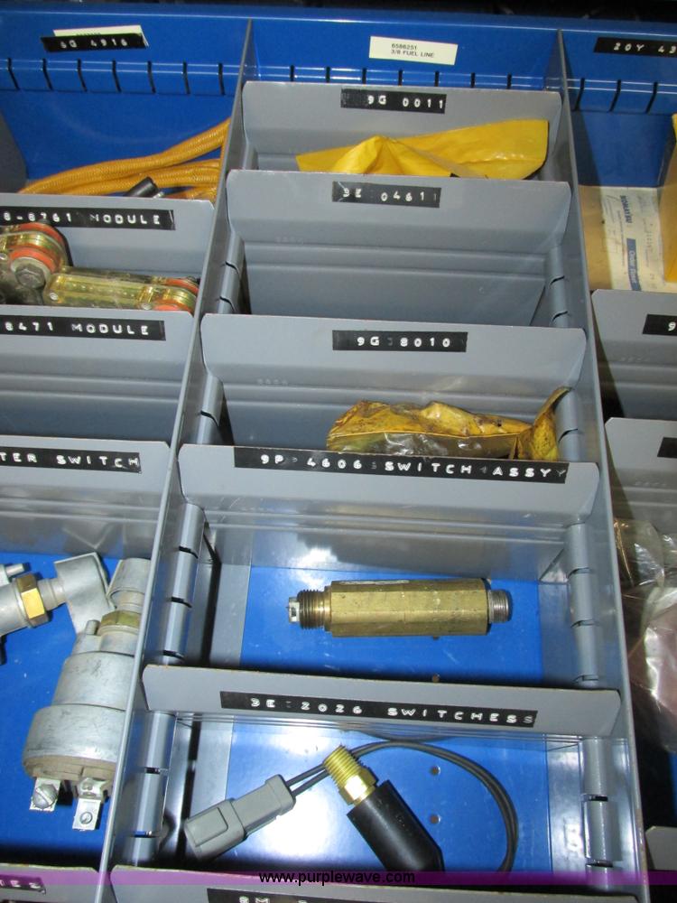 image for item V9965 Equipto parts bin and assorted Caterpillar parts