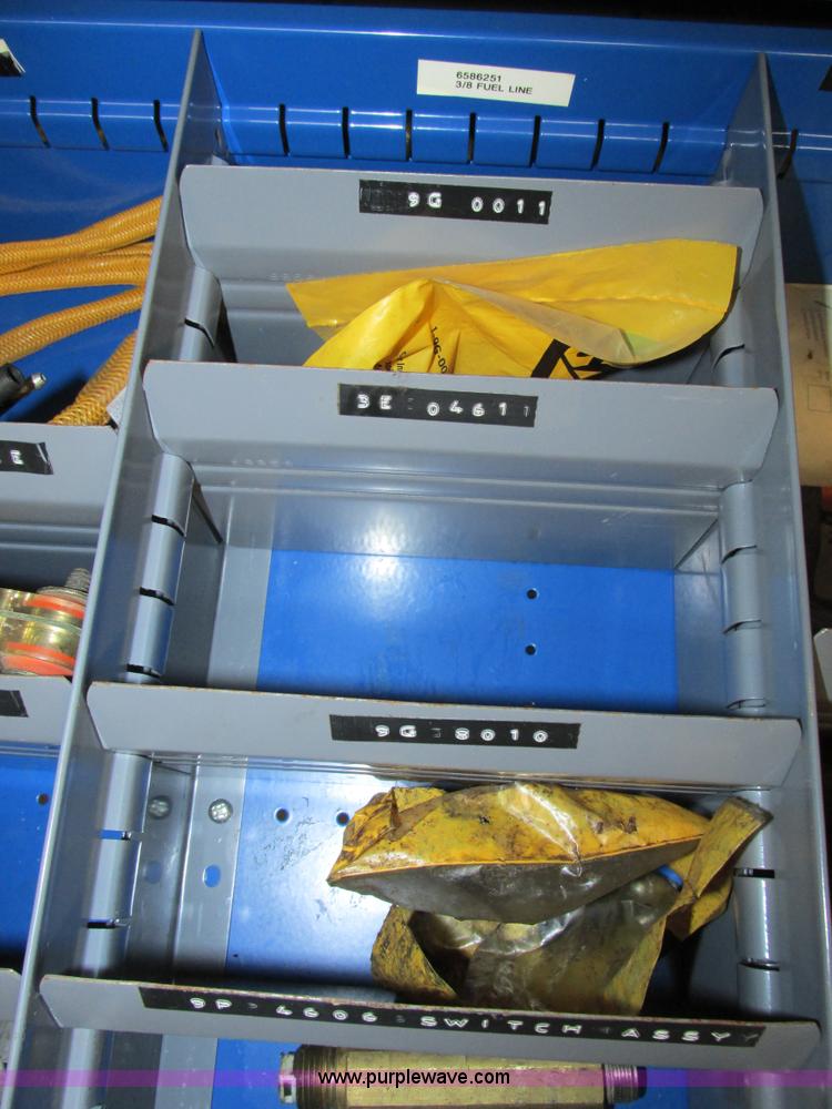 image for item V9965 Equipto parts bin and assorted Caterpillar parts