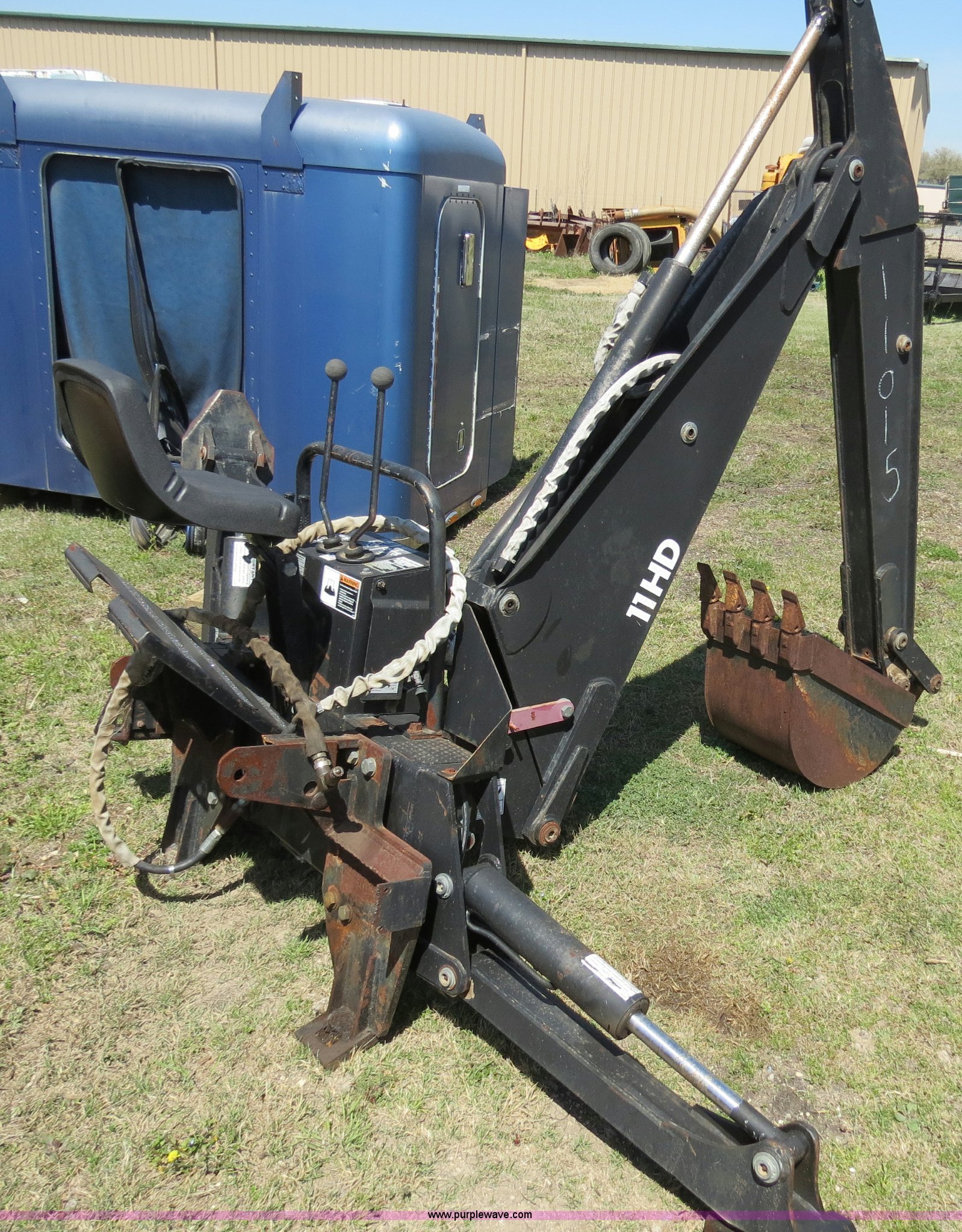 Bradco 11HD skid steer mounted backhoe attachment in Prosper, TX Item S9579 sold Purple Wave