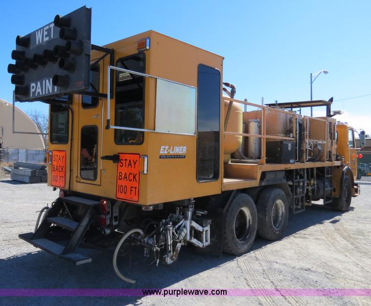 image for item B4643 1997 Volvo WX64 Ezliner paint striper truck