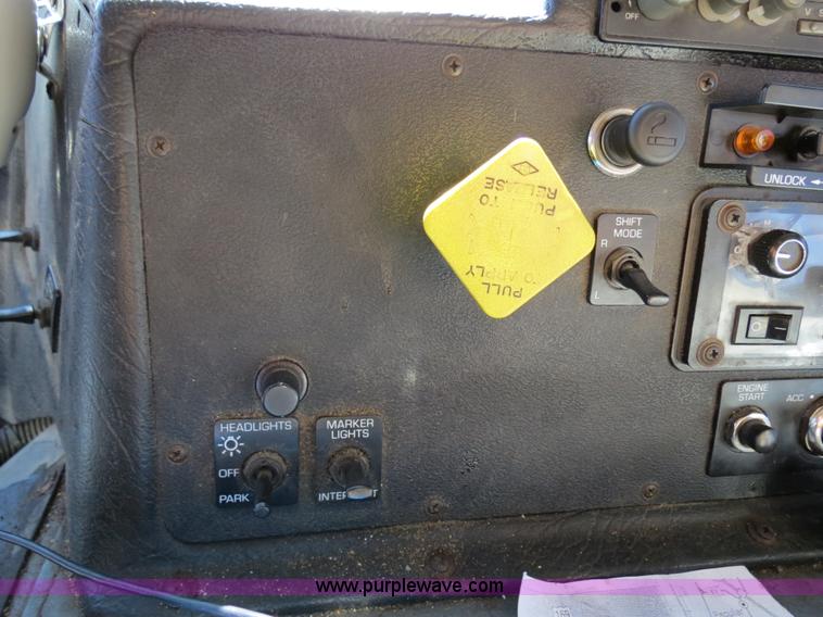 image for item B4643 1997 Volvo WX64 Ezliner paint striper truck