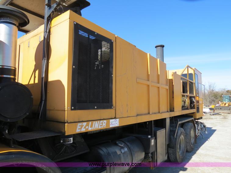 image for item B4643 1997 Volvo WX64 Ezliner paint striper truck