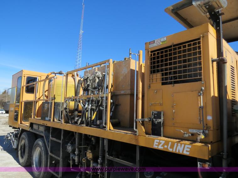 image for item B4643 1997 Volvo WX64 Ezliner paint striper truck