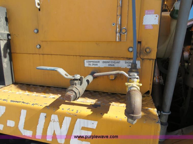 image for item B4643 1997 Volvo WX64 Ezliner paint striper truck