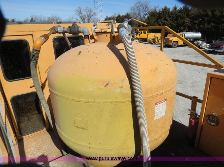 image for item B4643 1997 Volvo WX64 Ezliner paint striper truck