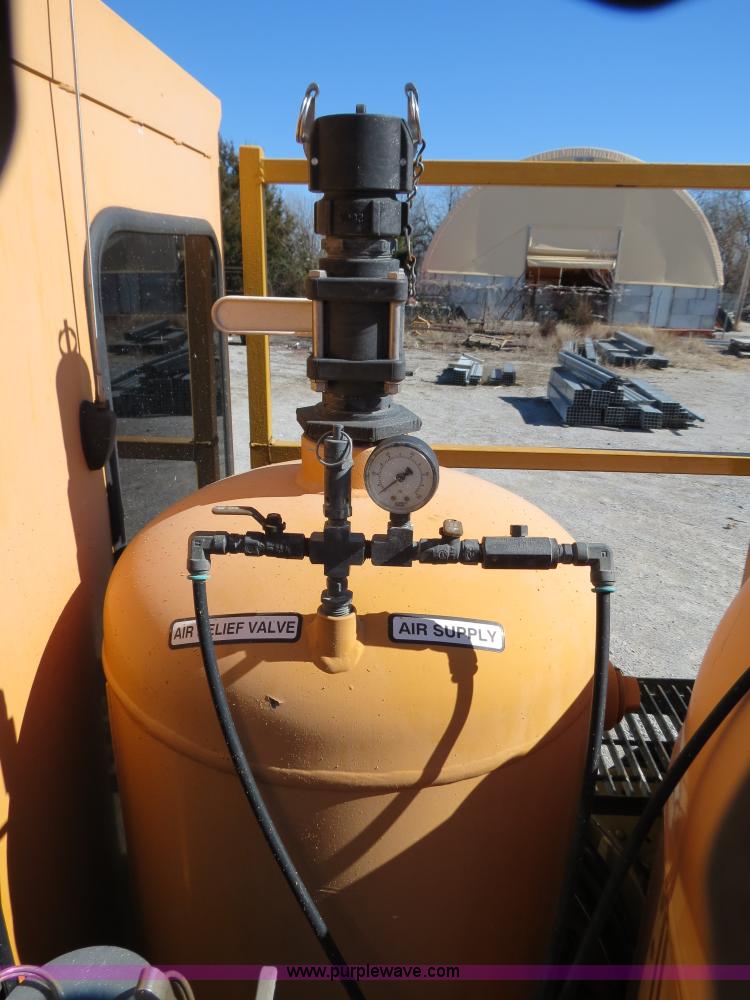 image for item B4643 1997 Volvo WX64 Ezliner paint striper truck