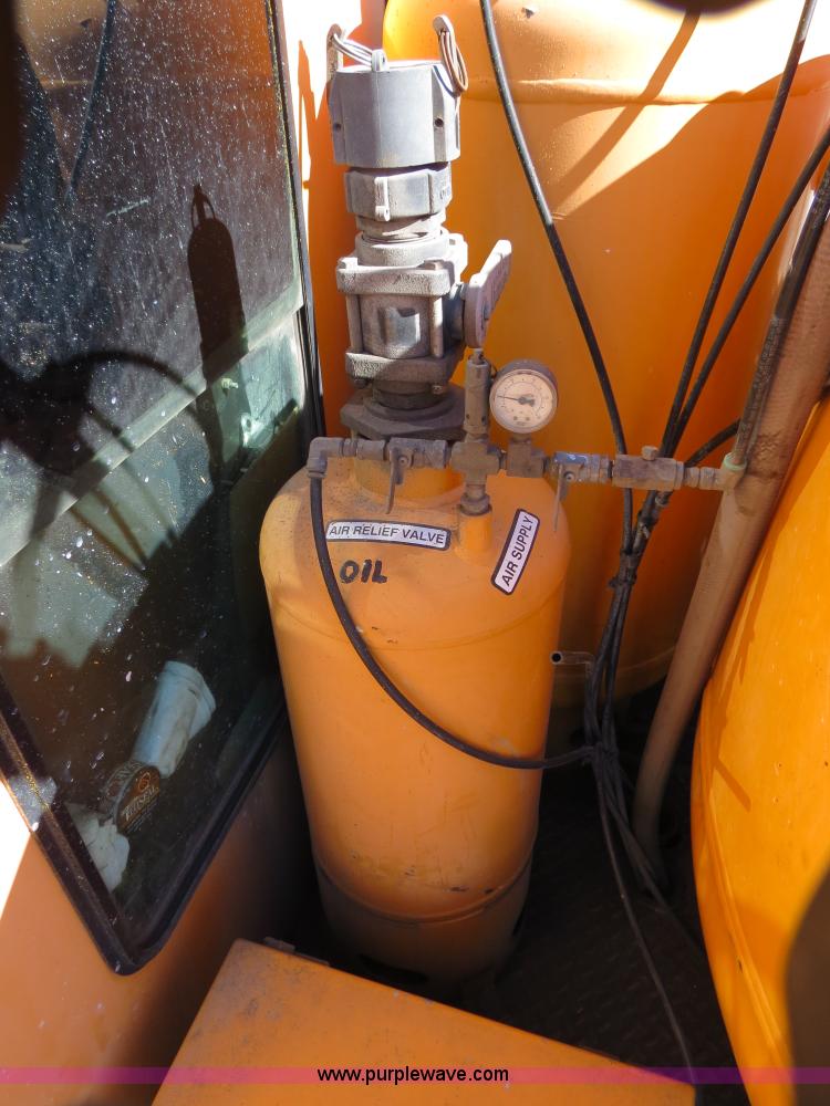 image for item B4643 1997 Volvo WX64 Ezliner paint striper truck