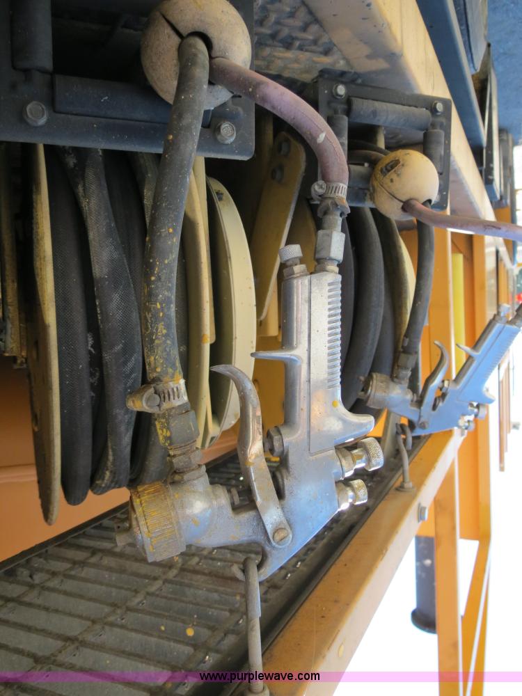 image for item B4643 1997 Volvo WX64 Ezliner paint striper truck