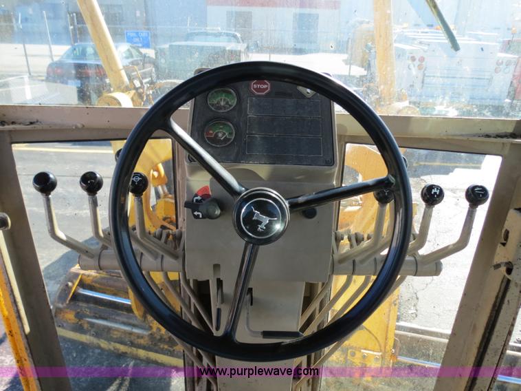 image for item F4349 1989 John Deere 670B articulated motor grader