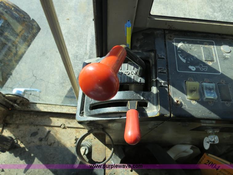 image for item F4349 1989 John Deere 670B articulated motor grader