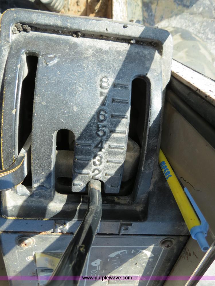 image for item F4349 1989 John Deere 670B articulated motor grader