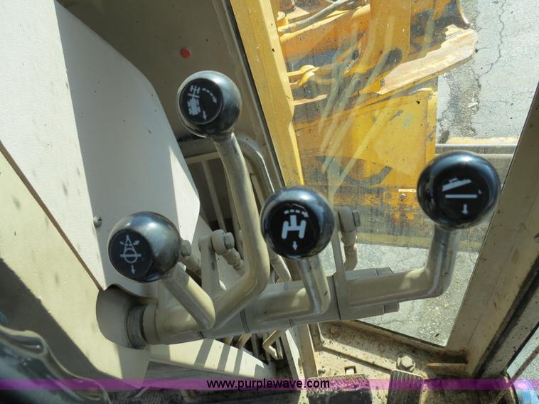 image for item F4349 1989 John Deere 670B articulated motor grader