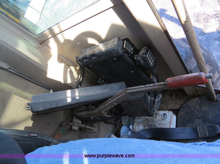 image for item F4349 1989 John Deere 670B articulated motor grader