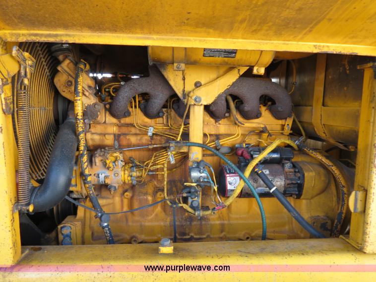 image for item F4349 1989 John Deere 670B articulated motor grader