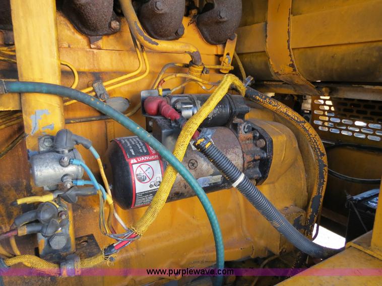 image for item F4349 1989 John Deere 670B articulated motor grader