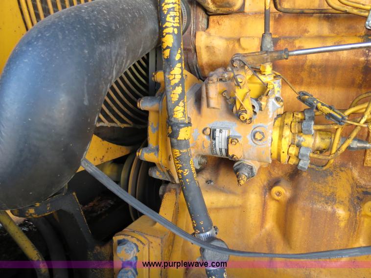 image for item F4349 1989 John Deere 670B articulated motor grader