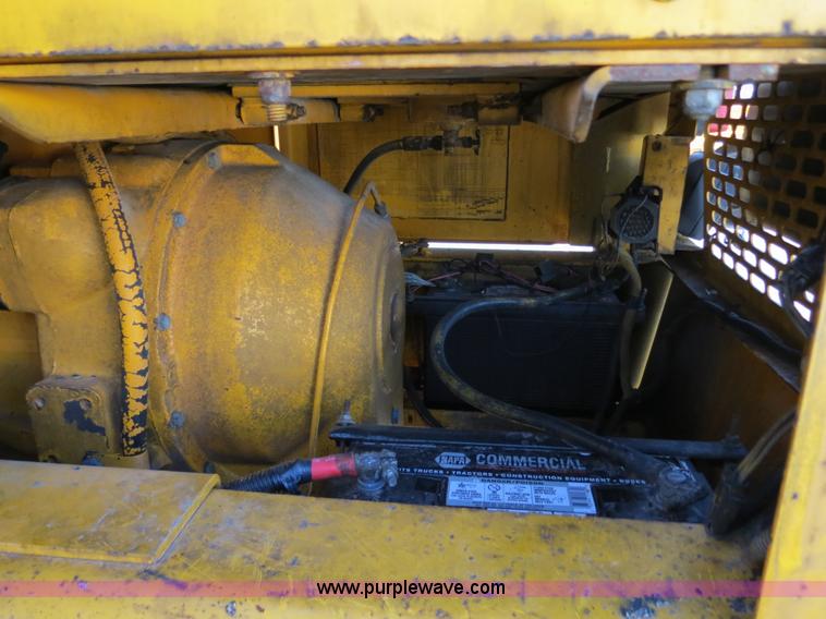 image for item F4349 1989 John Deere 670B articulated motor grader