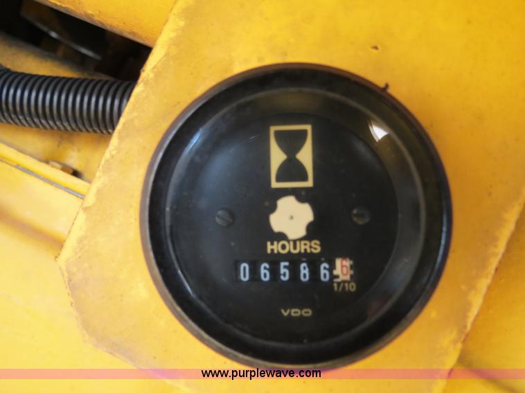 image for item F4349 1989 John Deere 670B articulated motor grader