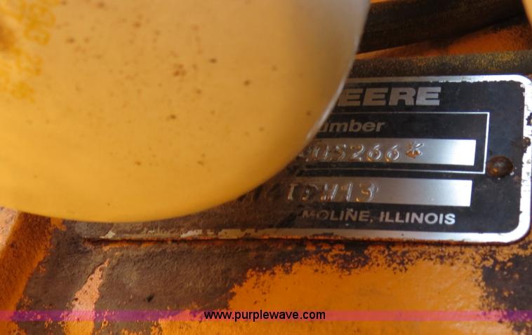 image for item F4349 1989 John Deere 670B articulated motor grader