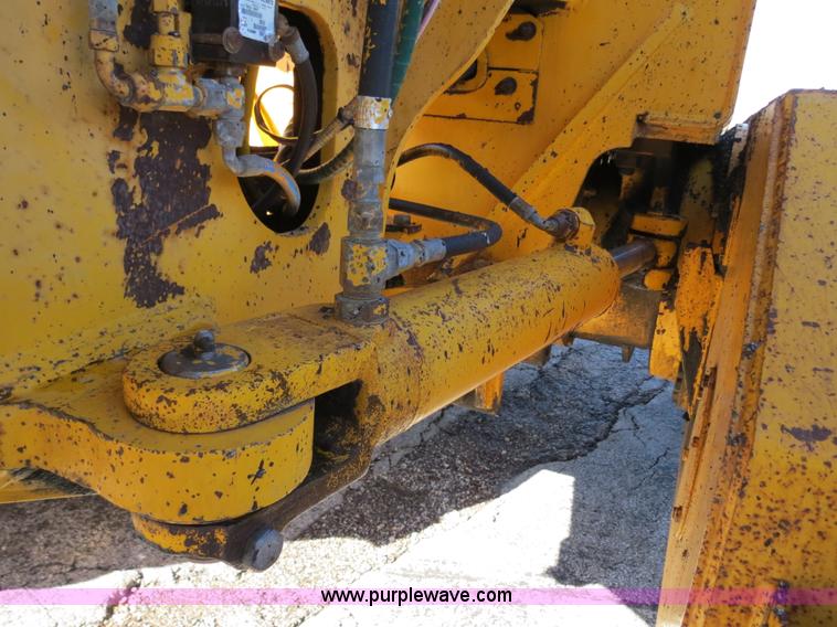 image for item F4349 1989 John Deere 670B articulated motor grader