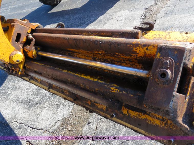 image for item F4349 1989 John Deere 670B articulated motor grader