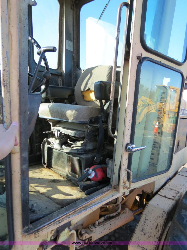 image for item F4352 1980 John Deere 670A articulated motor grader