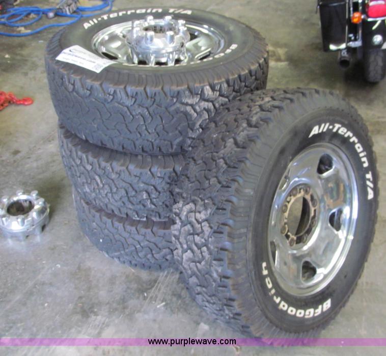 image for item E5990 (4) BF Goodrich wheels and tires