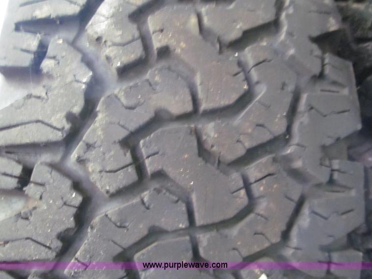 image for item E5990 (4) BF Goodrich wheels and tires