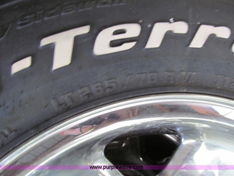 image for item E5990 (4) BF Goodrich wheels and tires