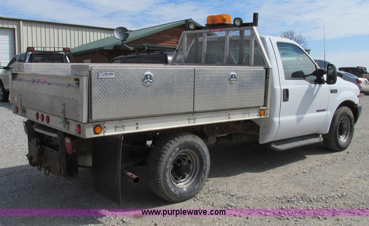image for item F4798 2001 Ford F350 Super Duty flatbed pickup truck