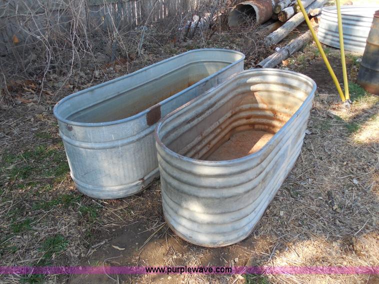 (3) metal water tanks in Hutchinson, KS Item A5140 sold Purple Wave