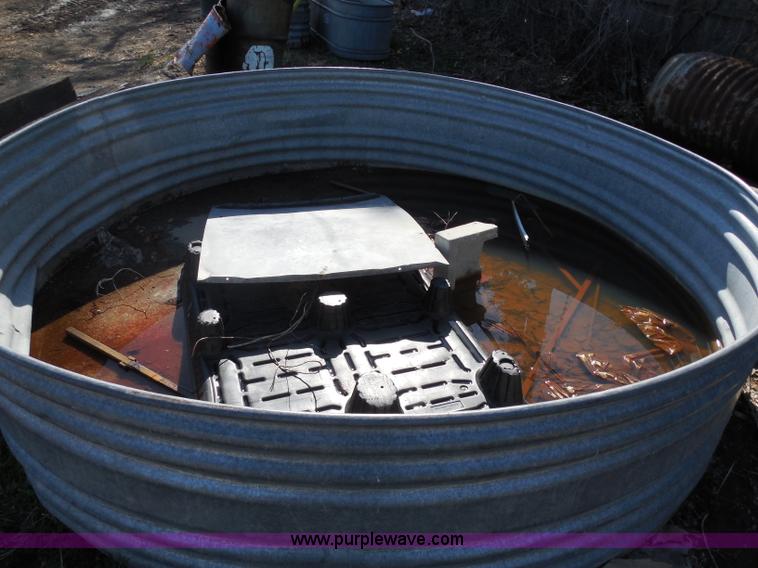 (3) metal water tanks in Hutchinson, KS Item A5140 sold Purple Wave