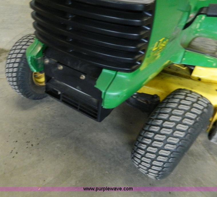 image for item W9030 John Deere LT180 lawn mower