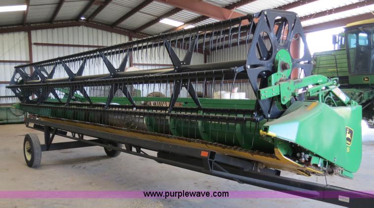 image for item B4730 1998 John Deere 925 25' flex platform header with 2011 Golden Belt header trailer