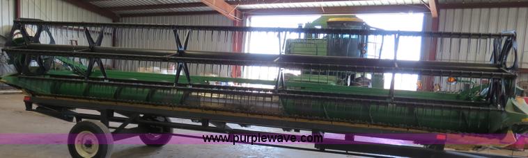 image for item B4730 1998 John Deere 925 25' flex platform header with 2011 Golden Belt header trailer