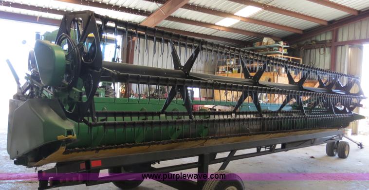 image for item B4730 1998 John Deere 925 25' flex platform header with 2011 Golden Belt header trailer