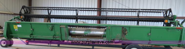 image for item B4730 1998 John Deere 925 25' flex platform header with 2011 Golden Belt header trailer