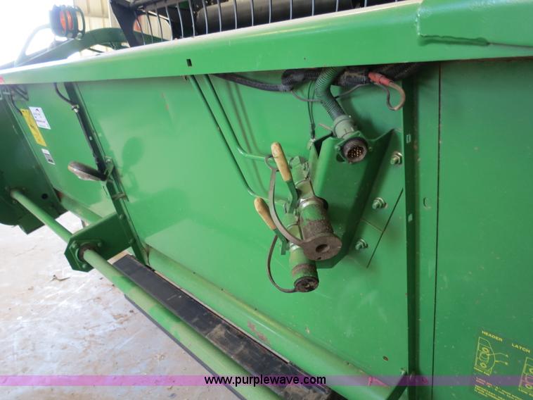 image for item B4730 1998 John Deere 925 25' flex platform header with 2011 Golden Belt header trailer