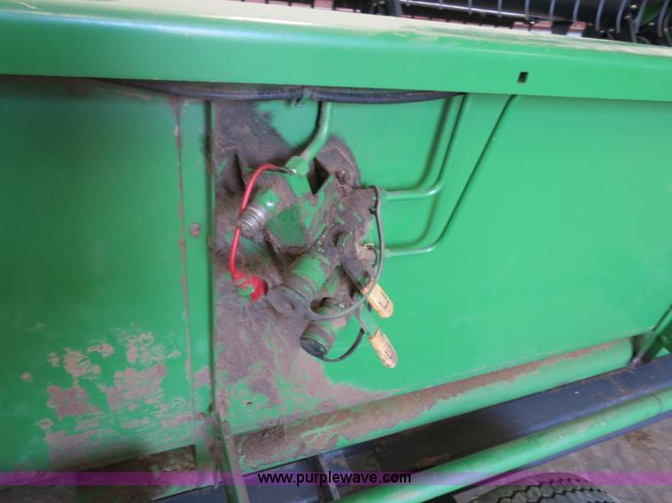 image for item B4730 1998 John Deere 925 25' flex platform header with 2011 Golden Belt header trailer