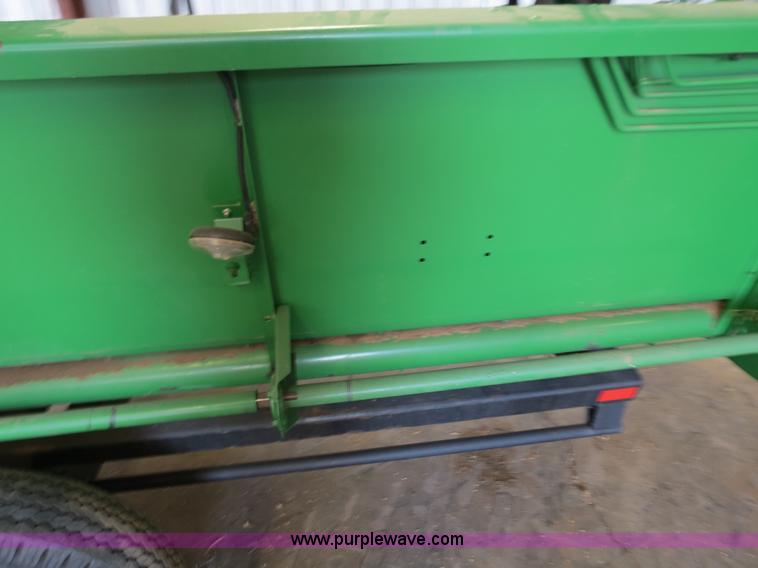 image for item B4730 1998 John Deere 925 25' flex platform header with 2011 Golden Belt header trailer