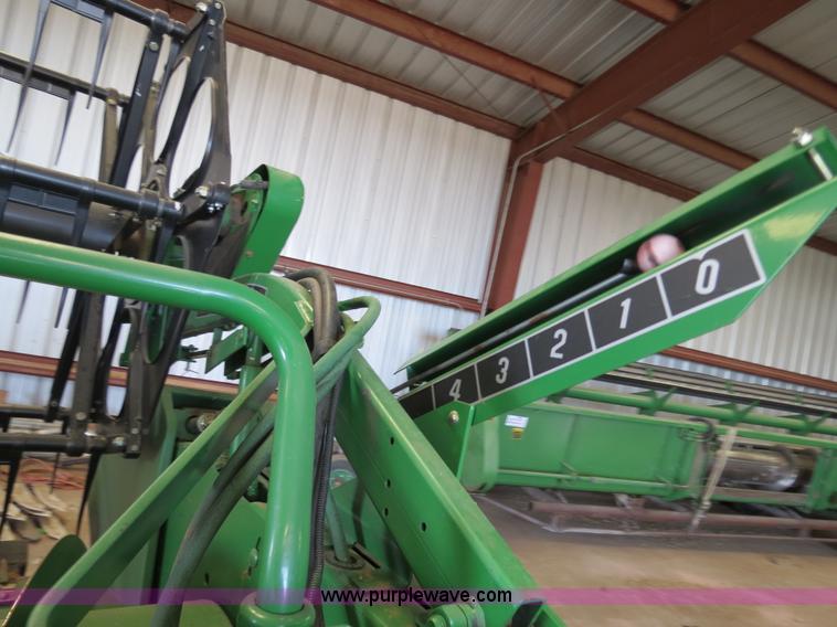 image for item B4730 1998 John Deere 925 25' flex platform header with 2011 Golden Belt header trailer