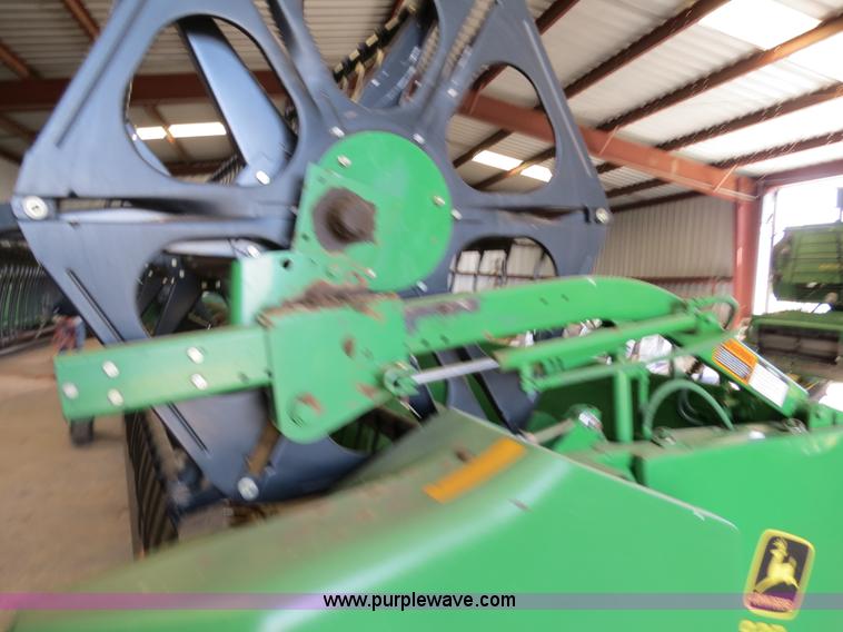 image for item B4730 1998 John Deere 925 25' flex platform header with 2011 Golden Belt header trailer