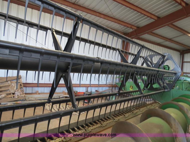 image for item B4730 1998 John Deere 925 25' flex platform header with 2011 Golden Belt header trailer