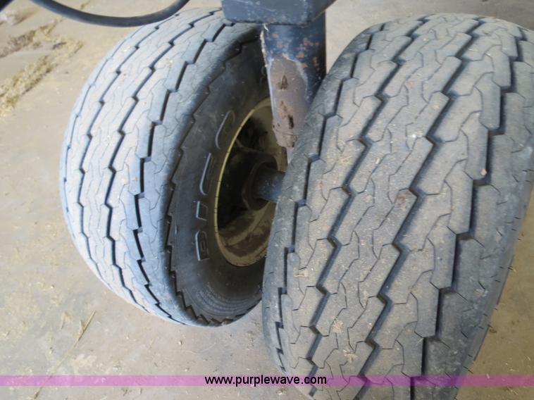 image for item B4730 1998 John Deere 925 25' flex platform header with 2011 Golden Belt header trailer