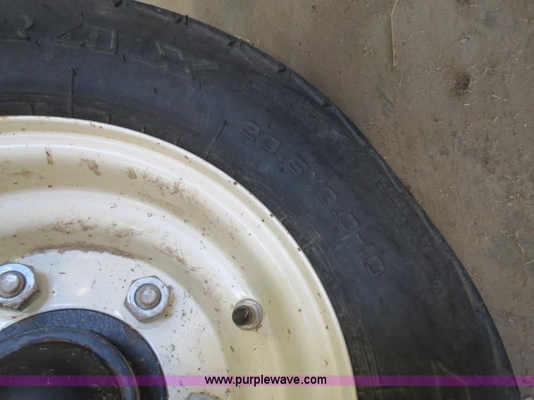 image for item B4730 1998 John Deere 925 25' flex platform header with 2011 Golden Belt header trailer