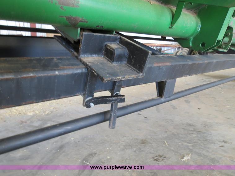 image for item B4730 1998 John Deere 925 25' flex platform header with 2011 Golden Belt header trailer