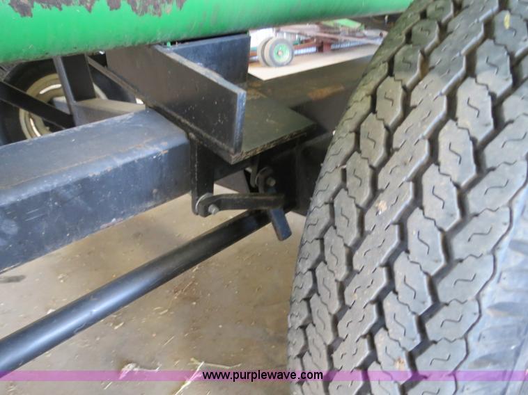 image for item B4730 1998 John Deere 925 25' flex platform header with 2011 Golden Belt header trailer