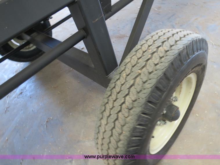 image for item B4730 1998 John Deere 925 25' flex platform header with 2011 Golden Belt header trailer